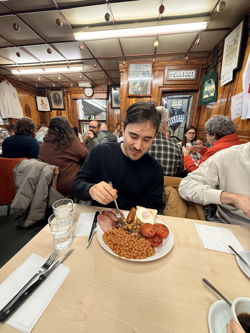 Masaki eating a full English breakfast at Pellicci's